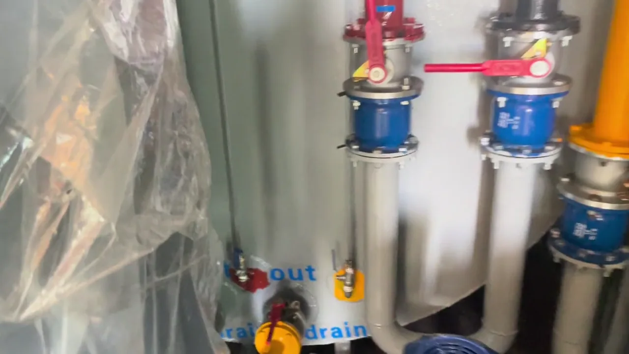 Pumps and labeled pipework inside a verified containerized fuel station project.